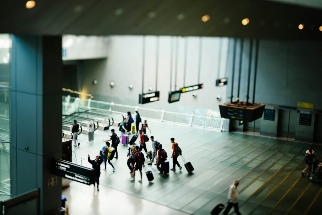 Travelers walking through an airport arrival hall